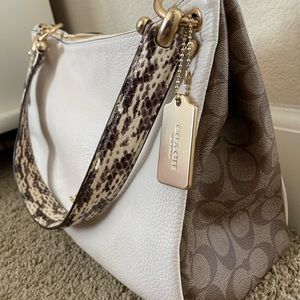 Pre-owned Coach satchel with python handle.
